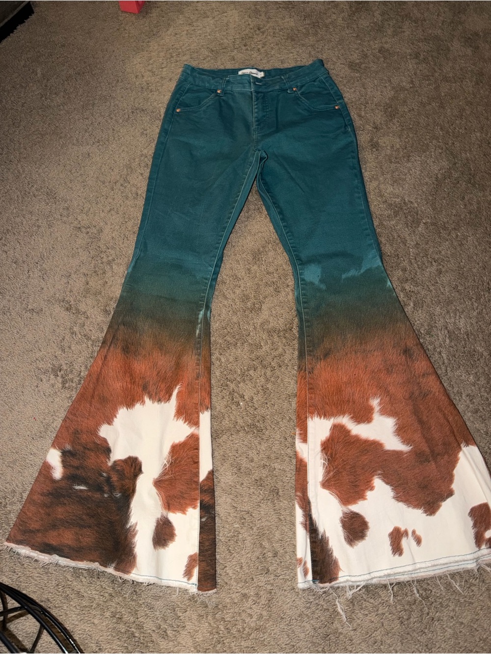 Teal cow print jeans